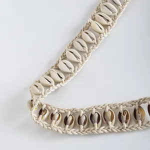 Handmade natural cowrie shell braided bohemian style waist belt detail close up view