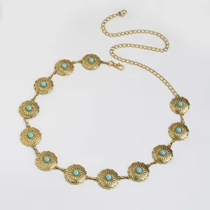 Vintage gouden metalen tailleketting met turkooizen stenen, boho stijl accessoire detailweergave.
