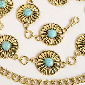 Detailed close-up view of western boho gold tone metal waist chain featuring turquoise stones.