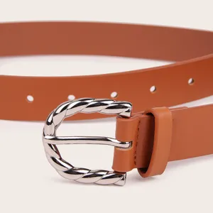 Detailed close-up of a women's brown PU leather belt featuring a stylish twisted metal buckle.