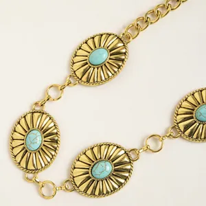 Detail view of the bohemian western style metal chain belt with turquoise oval medallions.