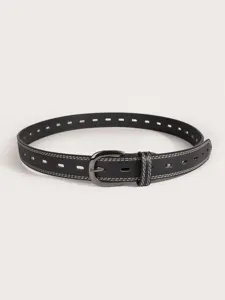 Detail shot of black women's belt with white stitching, hollow design and gun-black buckle.