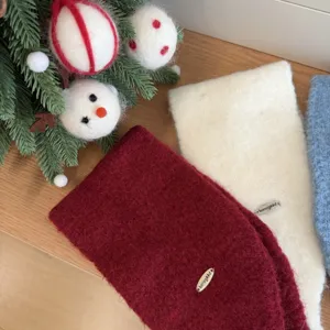 Detailed view of the cute knitted winter earmuffs, warm plush material, cozy design.