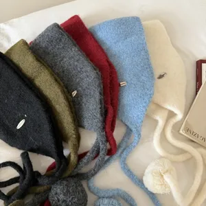 Korean style knit pom pom earflap hat detail showcase in multiple winter colors available now