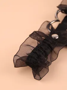 Black lace garter thigh ring with heart metal ring and stud, sexy lingerie accessory detail.