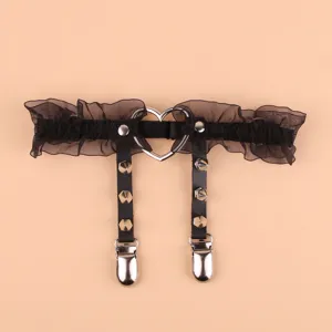 Black lace garter belt with metal heart ring and gothic rivets for women stylish outfit.