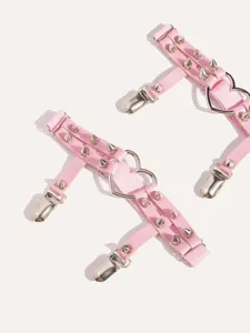 Pink punk garter belt with metal spikes and heart ring, sweet and edgy leg harness accessory.