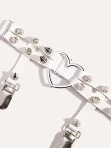 White punk garter belt detail with metal spikes and heart ring for women leg harness.