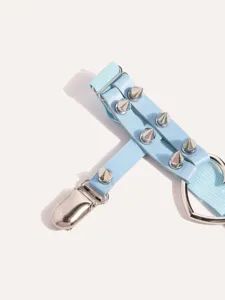 Light blue punk style garter leg ring detail with metal spikes and heart metal ring component.