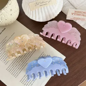 Chic acetate hair claw with sparkling rhinestones, cute heart and angel wings design.
