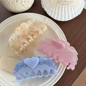 Elegant acetate hair claw clips with sparkling rhinestones and cute heart design for women.