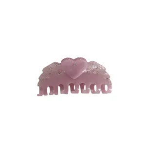 Pink resin hair claw clip with heart and angel wings, rhinestones, sweet style main view.