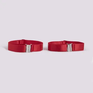 Red elastic leg ring boot garter detail shot showing fabric texture and metal clasps clearly.