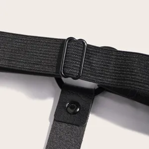 Close-up detail of black elastic garter strap with metal adjuster and leather connector.