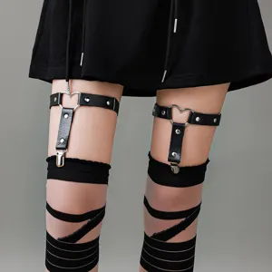 Gothic punk heart leg garter detail close-up showing adjustable leather strap and metal ring.