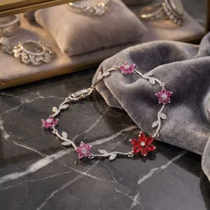 Exquisite floral bracelet with pink and red crystal petals, detailed vine design for daily wear.