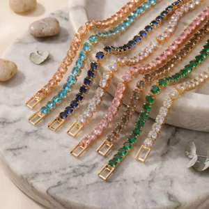 Elegant multi-color round cubic zirconia tennis bracelet set displayed on a marble tray.