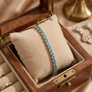Elegant gold-plated blue zircon tennis bracelet for women, classic sparkle design jewelry.