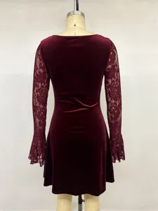 Detailed rear view of a velvet dress featuring sheer lace long sleeves and a fitted waist.