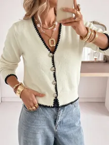 Detailed shot of women's European style V-neck knit cardigan with chic contrast trim for autumn.