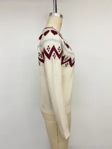 Side view of women's beige knit sweater with heart and geometric jacquard patterns long sleeve.