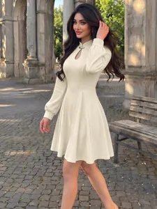 Retro neo-Chinese beige long sleeve mini dress with keyhole cutout and stand collar.