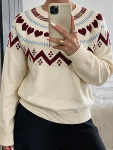 Detailed view of the women's cozy knit sweater featuring cute heart and chevron patterns.