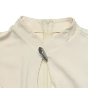 Collar detail of cream neo-chinese dress with metal clasp and zipper, elegant autumn style.