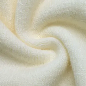 Soft off-white knitted cardigan fabric texture detail, warm and cozy autumn winter wear.