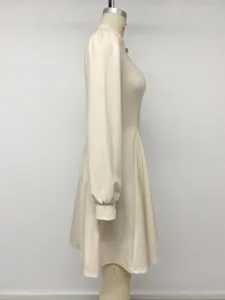 Beige long sleeve stand collar dress side view detail showcasing minimalist elegant style.