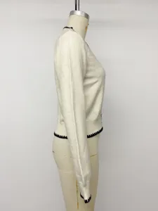Women casual V-neck knit cardigan sweater side view, elegant autumn winter style.