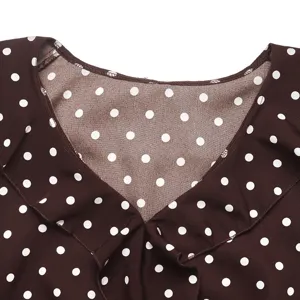 Close-up detail of womens brown polka dot v-neck ruffled shirt collar fashion apparel design.