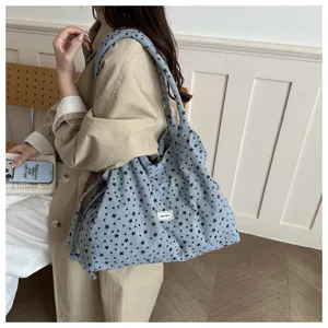 Bolso tote de lona azul para mujer con elegante estampado de estrellas y gran capacidad.