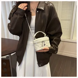 Mini quilted chain shoulder bag, stylish white crossbody vanity bag, trendy winter fashion.