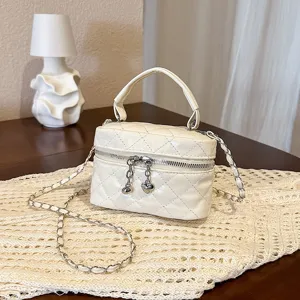 Chic white quilted mini vanity chain bag, versatile crossbody bag for women's daily fashion.