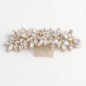 Detail view of gold rhinestone bridal hair comb, elegant crystal leaf updo insert accessory.