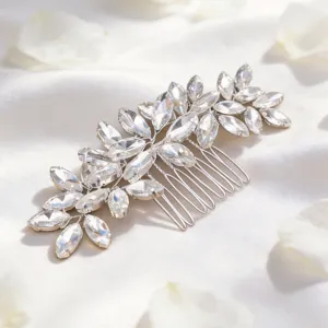 Close-up of elegant crystal wedding hair comb with rhinestone leaves for bridal updos.