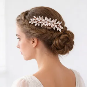 Detailed view of the crystal leaf bridal hair comb in rose gold, elegant wedding hair accessory.