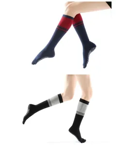 Detailed view of long toe yoga socks with non-slip grip dots and striped design.