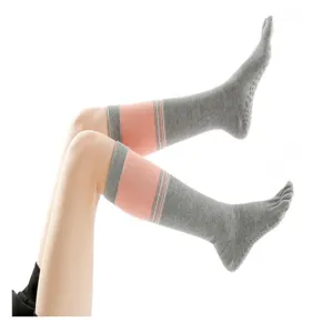 Long five-finger yoga socks with anti-slip dots, comfortable knee-high design for winter.