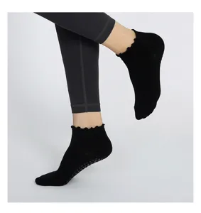 Women summer thin non-slip yoga socks detail view, featuring black ruffled cuffs and grip dots.
