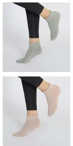 Detail shot of women's ruffled grip yoga socks with breathable fabric and anti-slip sole.