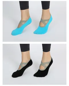 Non-slip yoga socks with cross straps for women, pilates fitness and indoor sports wear.