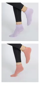 Detail view of women's summer thin ruffled yoga socks with non-slip grip soles for indoor sports.