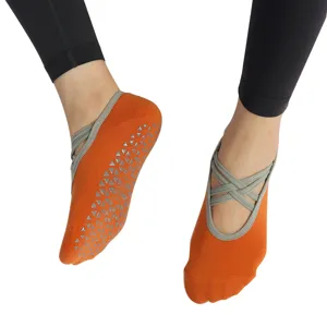 Non-slip yoga socks with cross straps, perfect for Pilates, fitness, and indoor workouts.