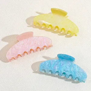 Pastel hair claw clips set in yellow, pink and blue acetate for cute daily hairstyles.