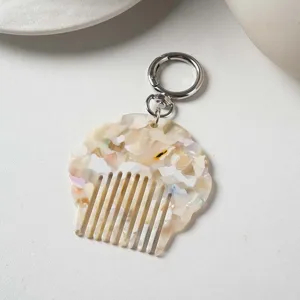 Portable mini acetate shell comb keychain, stylish marble pattern bag charm and hair comb.
