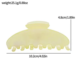 Close-up detail of a translucent glitter hair claw clip showing size dimensions and lightweight design.