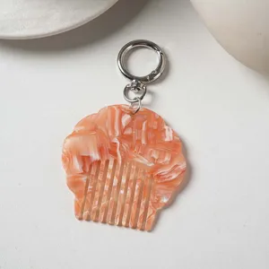 Portable mini acetate shell comb keychain, pearlescent marble bag pendant for women.