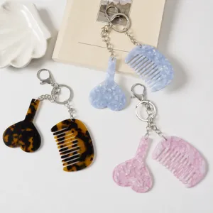 Cute acetate heart and comb keychain bag charm set, stylish design pendant accessory.
